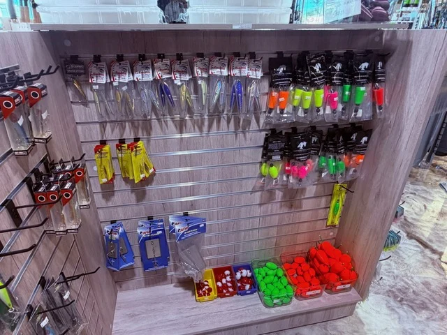 Brightly colored tackle items on a pegboard display