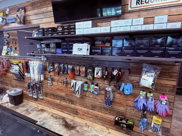 Fishing accessories and small products on wood shelves