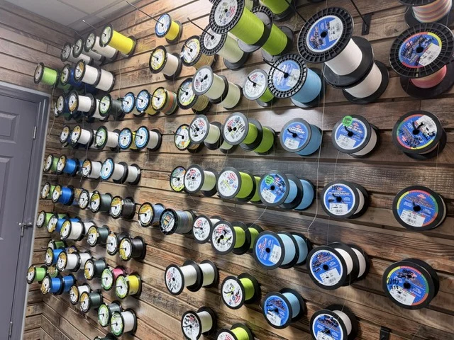 Rows of colorful fishing line spools