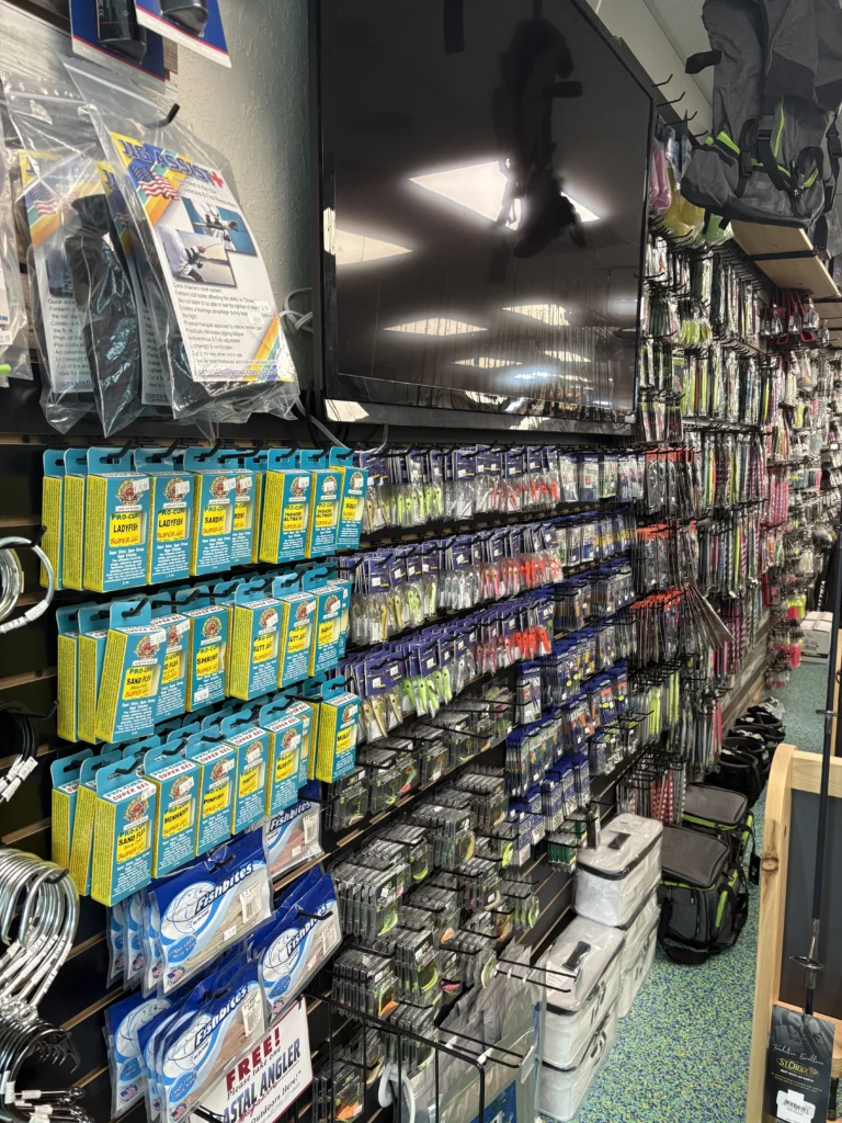 Packaged lures and tackle arranged on display hooks
